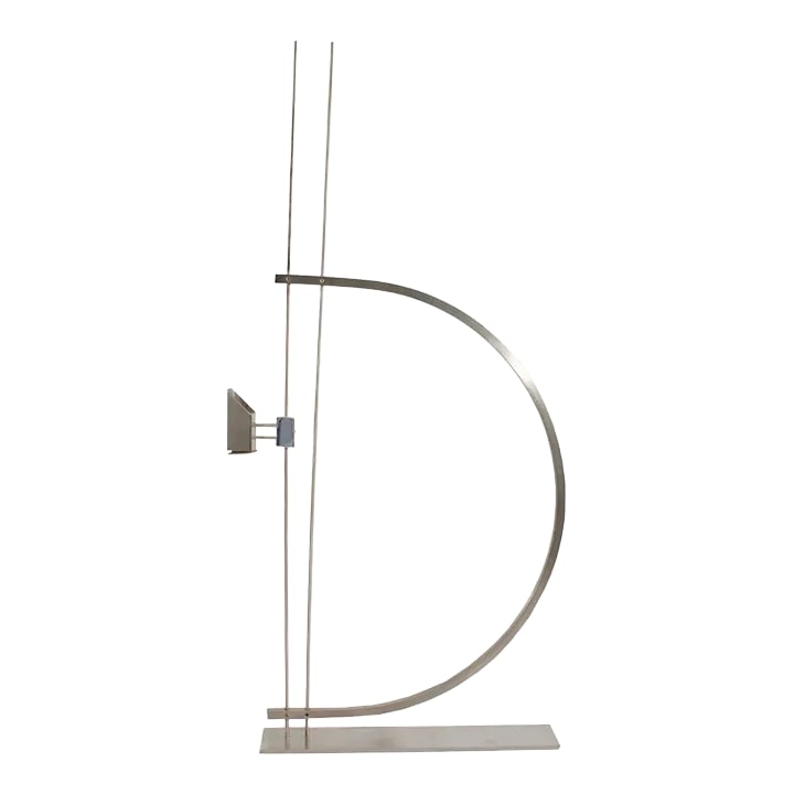 2000 "Prologue" Postmodern Candlestick Holder by Robert Zelman: A Postmodern metal candlestick holder designed by the American designer David Zelman (born 1945) for his company Prologue 2000. The candleholder has two metal prongs that sit perpendicular with a