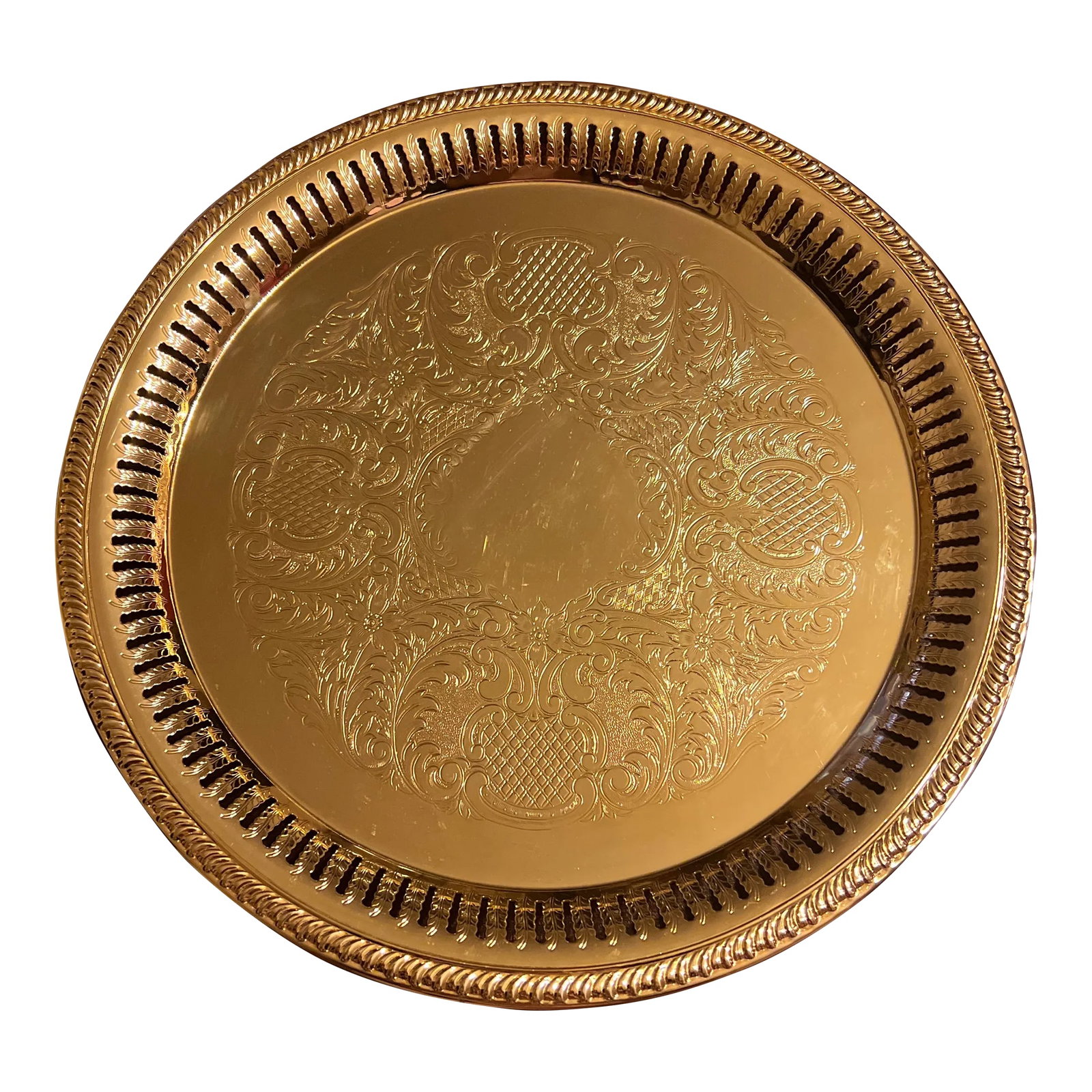1980s 24 Karat Gold Plated Serving Service Tray: Beautifully designed with elaborate detail, a vintage 24 karat gold plated tray features: - reticulated rim - measures 12.25" diameter; .5" - 5/8" height - pre-owned condition; some surface wear -