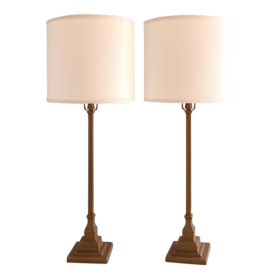 Palecek Hollywood Regency Ridge Metal Lamps - A Pair: A showroom pair of striking vintage Palecek Ridge Metal Table Lamps from NYC. Featuring solid cast iron bases and bodies with a hand-finished antiqued rust finish. White linen round drum shades (origi