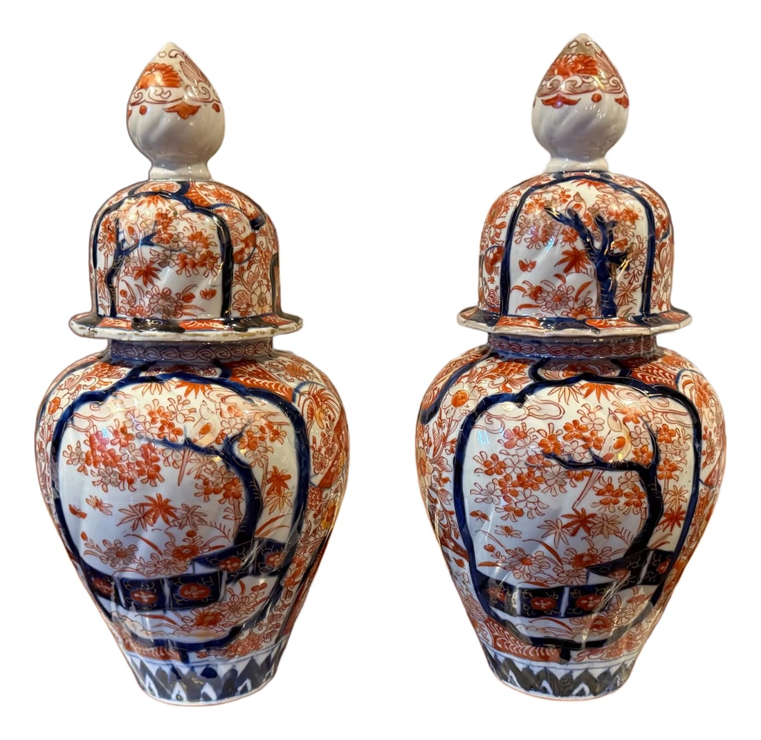 Antique Japanese Pair of Late Meiji Period Hand Painted Porcelain Imari Style Lidded Ginger Jars: Circa 1900, late Meiji period, Beautiful pair of Imari porcelain ginger jars, featuring intricate hand-painted floral and landscape motifs in rich cobalt blue and iron-red hues. Originating from the