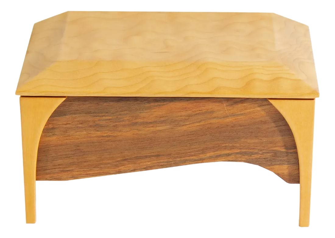 Wooden Jewelry Box Signed by Mark Rehmar: A wooden jewelry box designed by the American artist Mark Rehmar. The two-tone wooden jewelry box has four legs and a hinged top. The interior of the box is lined with maroon fabric. The underside of 
