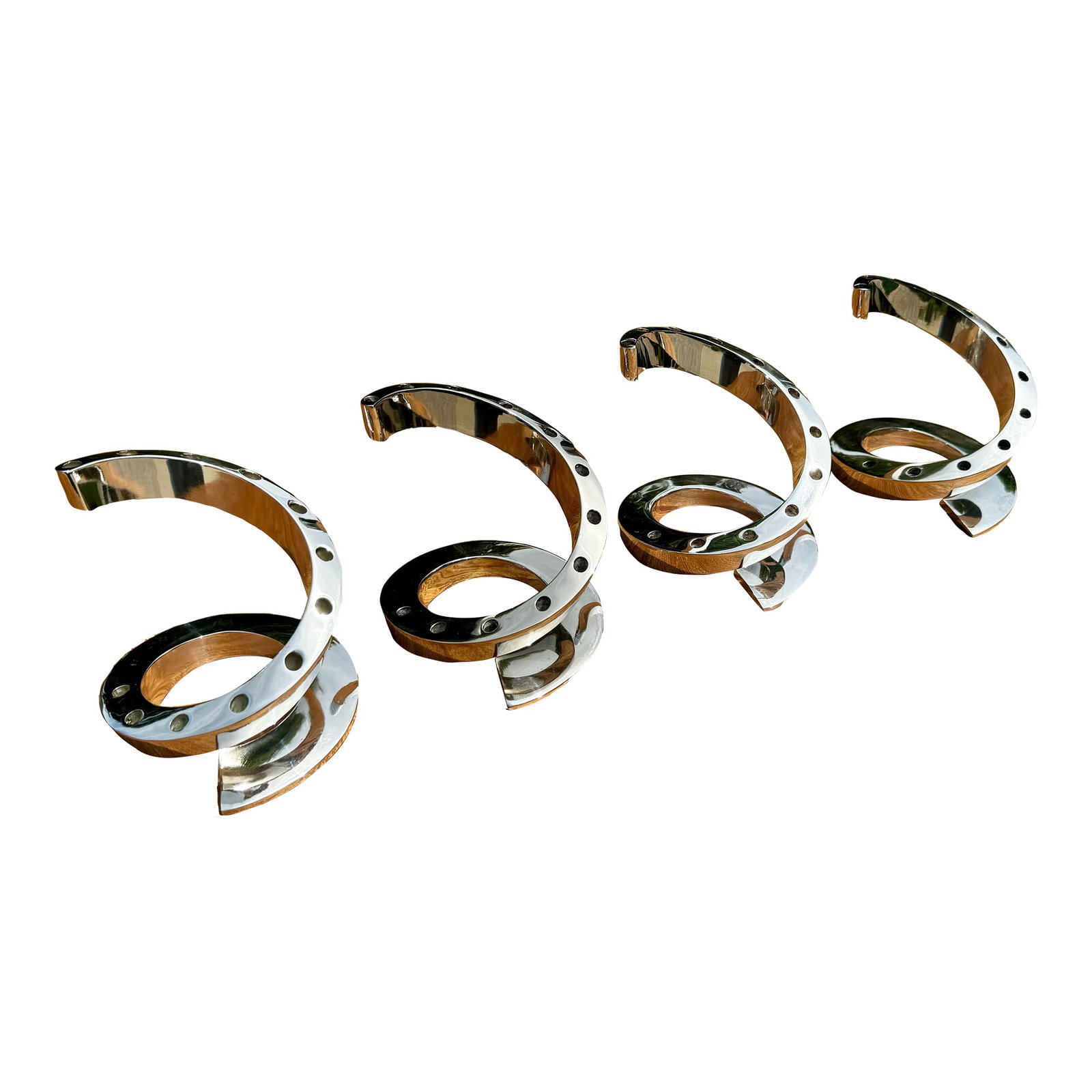 Mid 20th Century Dansk Silver Candle Holders- Set of 4: Four vintage silverplated candle holders designed by Bertil Vallien made by Dansk. Each holder is of a spiral design and has 12 holes for thin taper candles. 48 thin black taper candles included in th