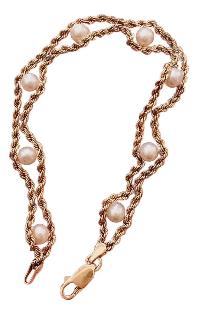 Vintage 10kt Gold & Pearl Bracelet: Authentic vintage circa 1980s Vintage designer unknown In excellent vintage condition 10kt solid gold with real pearls 14kt solid gold lobster clasp Measures 7 1/2'' in length by just under 1/2'' in w
