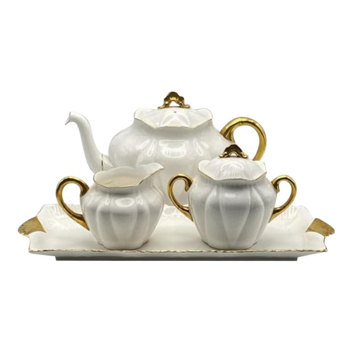 Mid 20th Century Shelley White & Gold Regency Dainty 4-Piece Tea Set With 4-Cup Teapot, Sugar, Cream: Beautiful tea set with matching sandwich tray from the Regency collection by Shelley (England). Features bright white fine bone china with gold detail in Shelley's iconic "Dainty" shape. The "Regency"