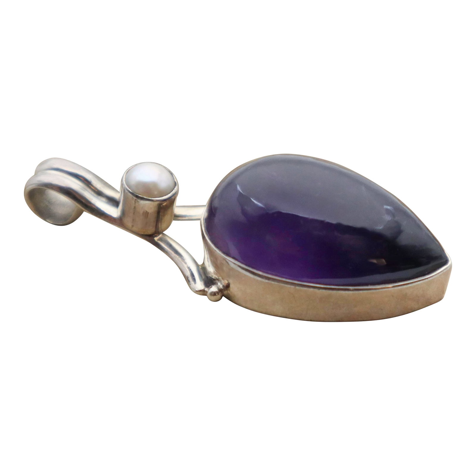 Vintage Amethyst With Pearl Sterling Silver Pendant: Formed over millions of years, the prehistoric amethyst gemstone has been marveled throughout history. Regarded as one of the most precious gemstones, as valued as diamonds and a symbol of royalty,