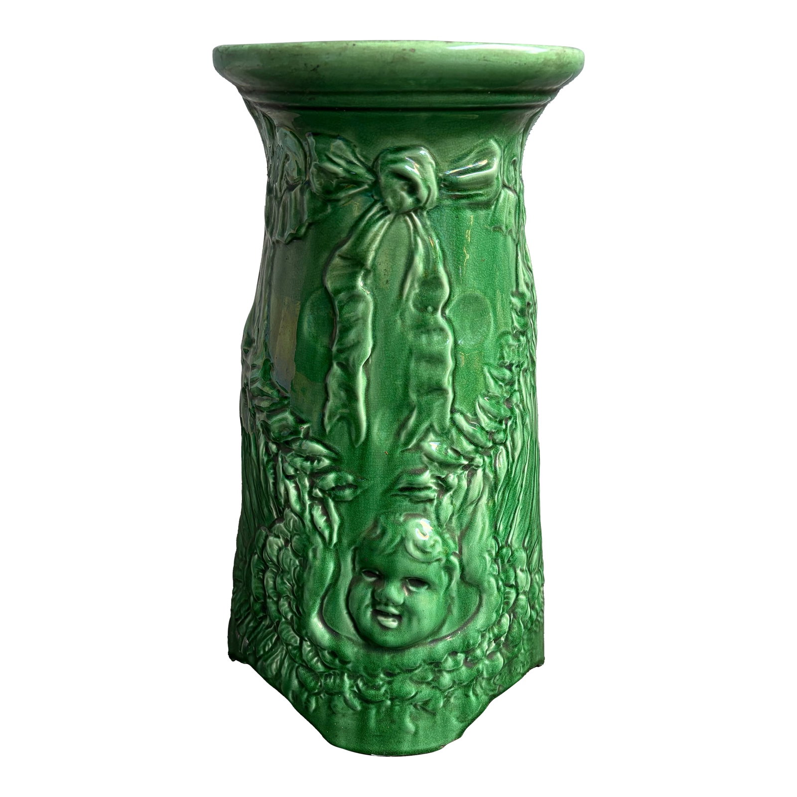 Green Cherub Pedestal for Jardinere: Beautiful pottery piece. Cherub and floral design. Condition: Alterations: Original Condition Unaltered Imperfections: Some Imperfections Condition Notes: One small chip on the bottom where it sits. O