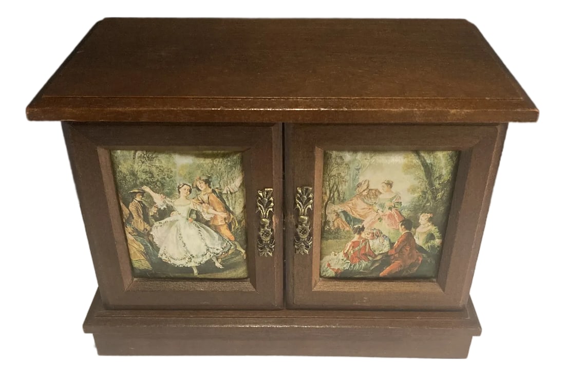 Vintage Wooden Jewelry Music Box With Romantic Scene Panels: A beautiful vintage finds wooden jewelry box featuring double doors with painted romantic scene panels and ornate brass-style handles. With two drawers, this piece combines classic design with practic
