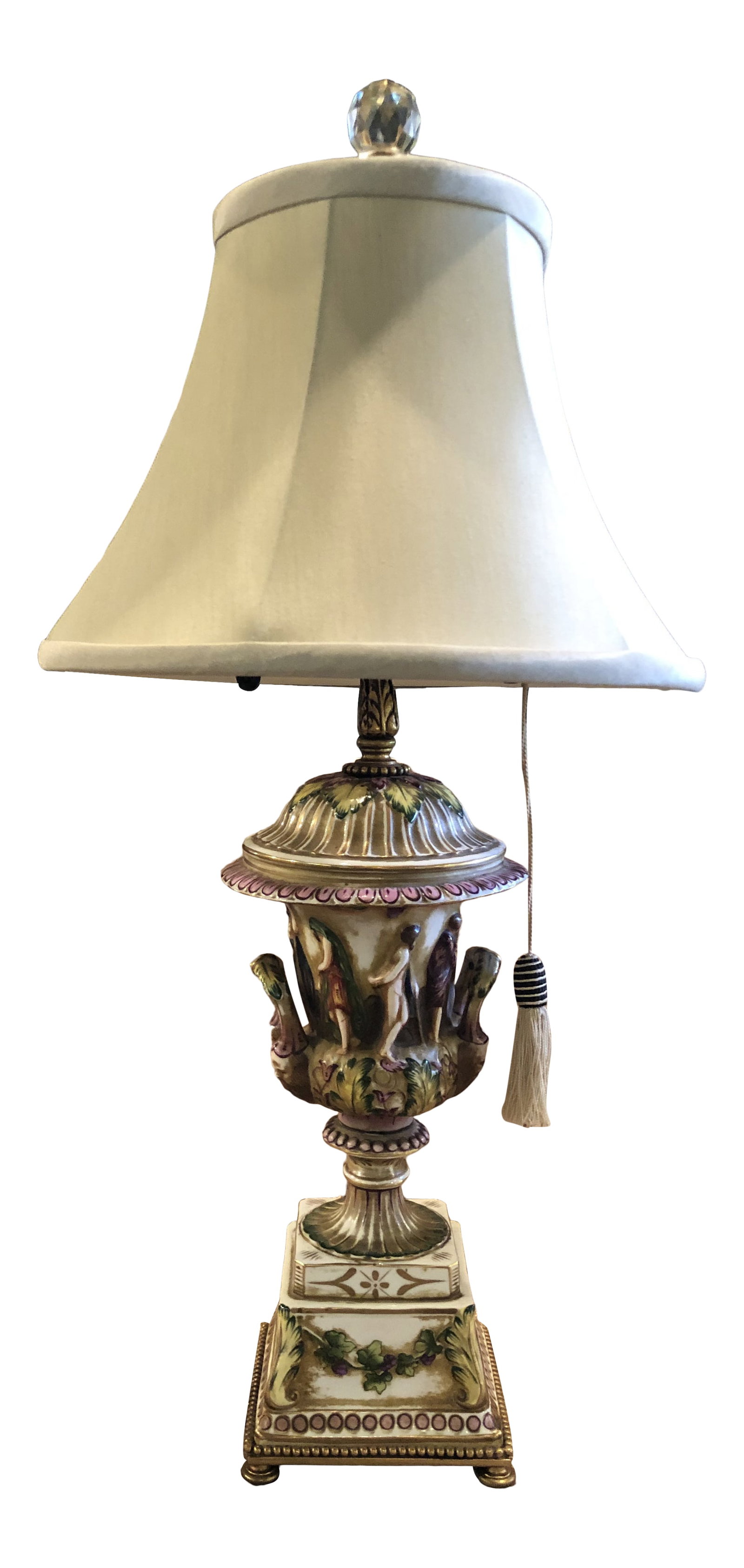 Vintage Italian Porcelain Figural Hand Painted Gilt Table Lamp With Shade: Vintage Hand Painted and Gilt Porcelain Italian Figural Table Lamp. Wonderful scale and dimensions. 2 light sockets with pull chains. One chain includes a tassel as shown for easy access when using on