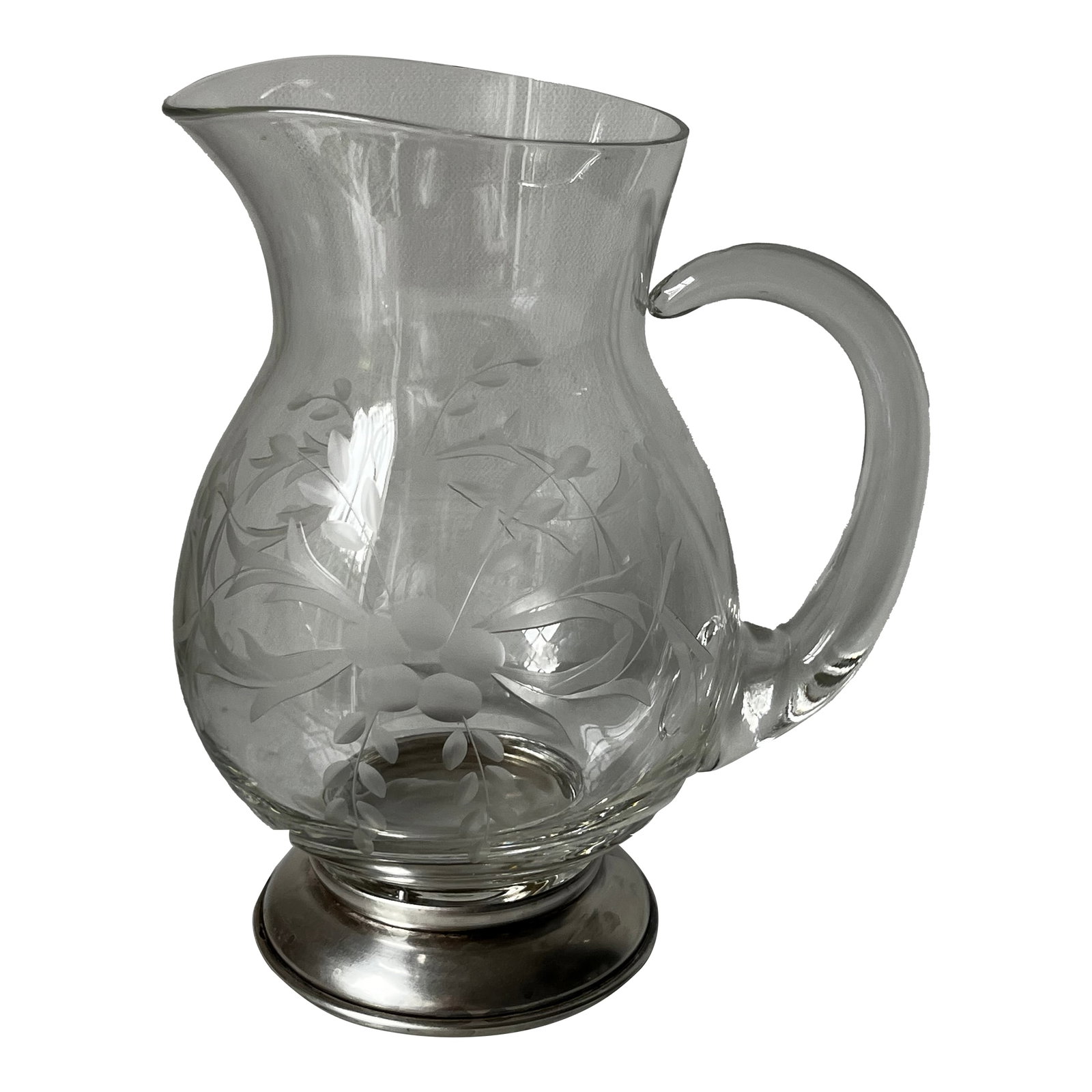 1930s Etched Crystal Pitcher, Also Known as a "Pot Belly Pitcher," With a Sterling Silver Base: This is an etched crystal pitcher, also known as a "pot belly pitcher," with a sterling silver base. The etching on the glass features a pattern of grapes and laurel leaves. It is described as an earl