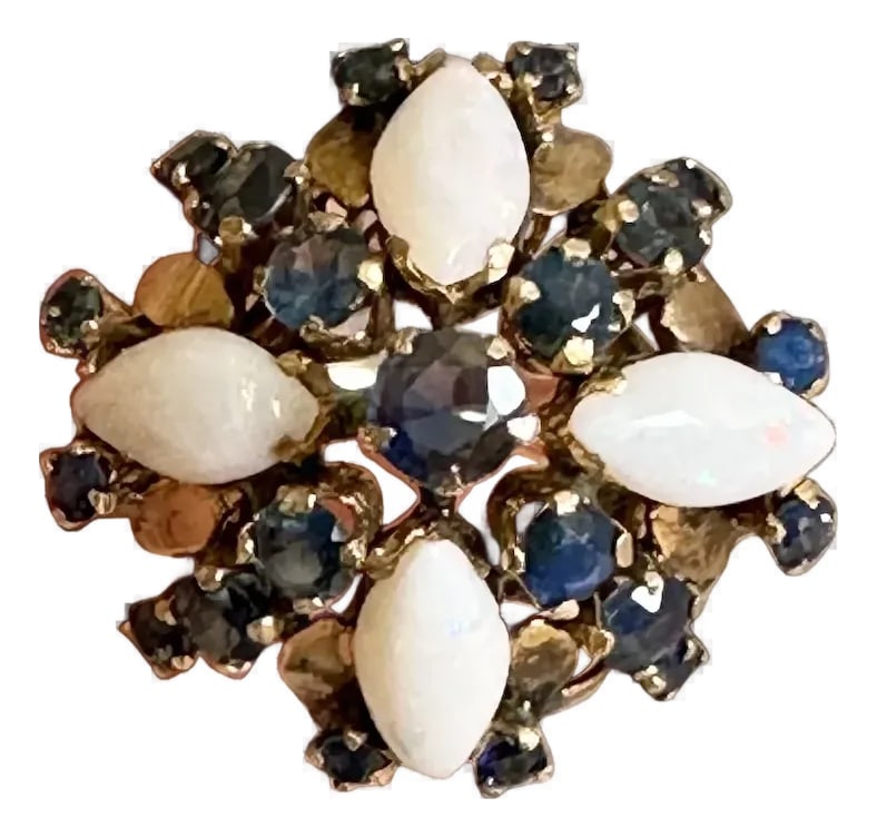 Late 20th Century 14k Sapphire and Opal Ring, Size 5: 14k gold opal and sapphire ring. Gorgeous ring featuring a center sapphire flanked by four marquis cut opals and 20 small sapphires. Wonderful design measuring 1" across the finger, and the ring is a 