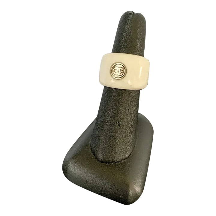 Chanel White Resin Ring, Size 6.5: Chic, vintage Chanel ring. Features the interlocking "C" logo in the front. Open back. White, marbled detailing. Super light and comfortable to wear. Size 6.6, 5/8" tall. Purchased at the Chanel
