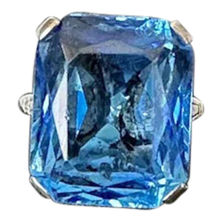 Mid 20th Century French Sterling Blue Faceted Stone Ring, Size 6.5: Breathtaking French sterling ring with a blue glass stone. This ring features a 17mm x 13.5mm rectangular faceted stone that is mesmerizing. The stone is showcased within a beautiful setting