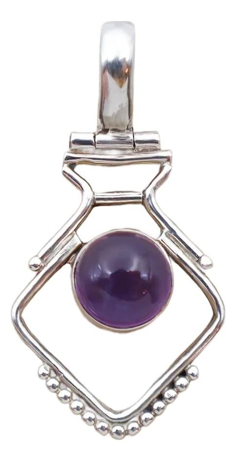 Vintage Modern Amethyst Sterling Pendant: Vintage artesian crafted pendant with a modern sterling silver structure with natural amethyst gemstone at its center. With a beautiful purple color and inclusions shown as it catches the light.