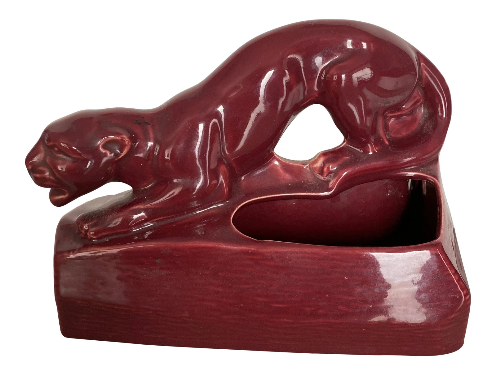 1950s Panther Ceramic Sculpture: Wonderful stylized claret colored panther probably 1950s could be used for a pot a lamp or a catchall Condition: Alterations: Original Condition Unaltered Imperfections: Some Imperfections Condition