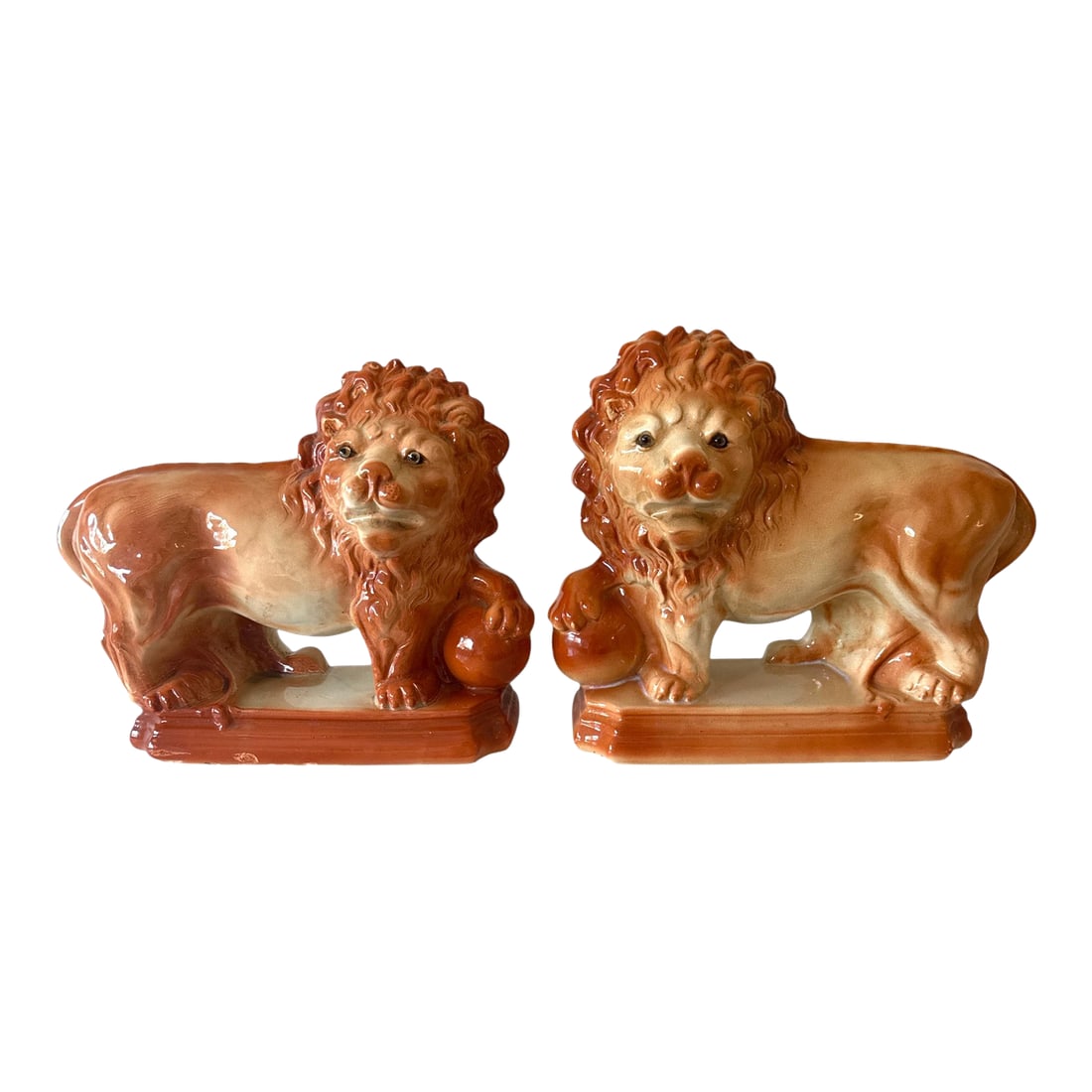 Antique Staffordshire Mantle Lions With Paws on Orbs - 11.5" Tall - A Pair: A striking and substantial pair of antique Staffordshire lions, each proudly resting a paw upon an orb. These classic English pottery figures date to the late 19th century, circa 1880-1900, and were