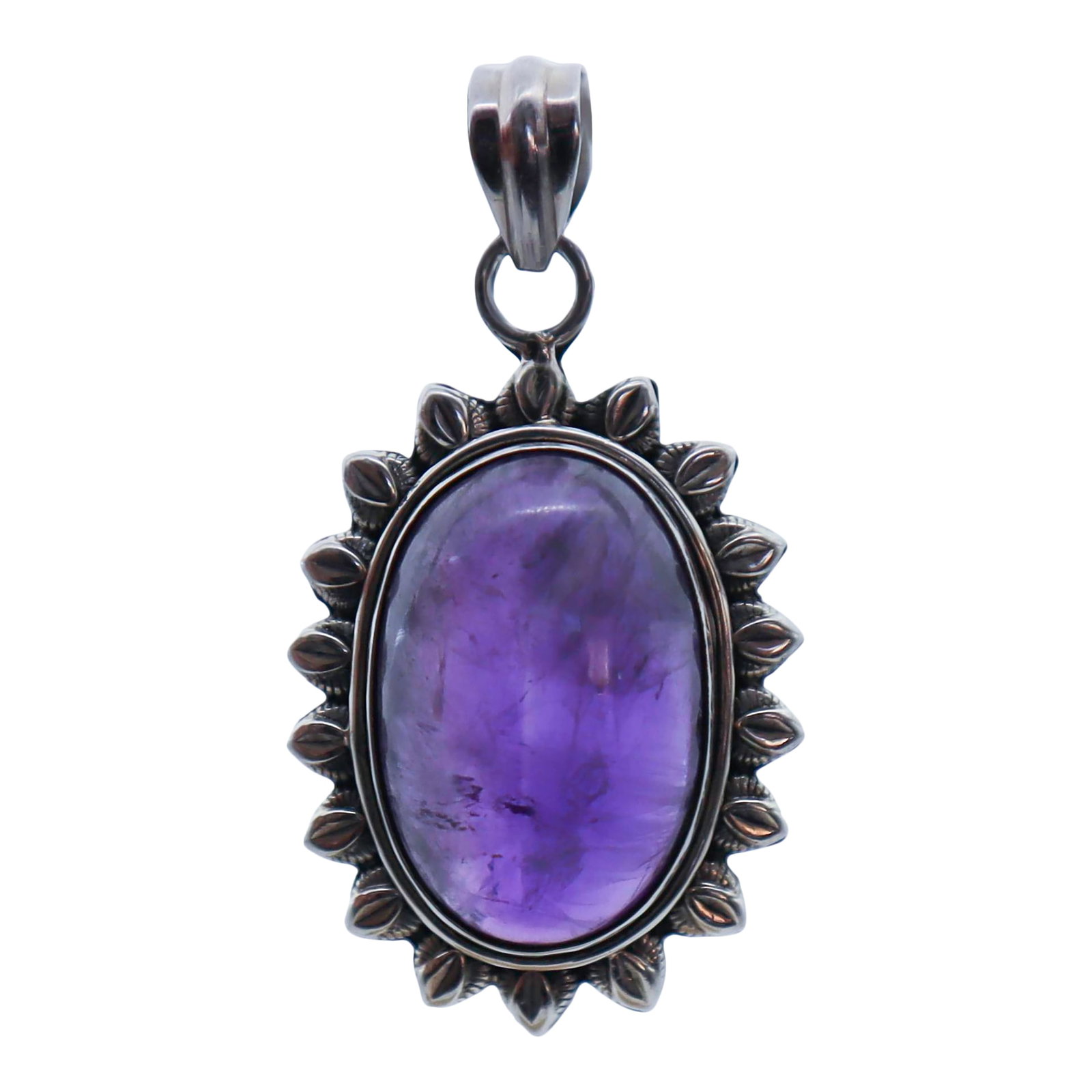 Vintage Amethyst With Sterling Silver Starburst Pendant: Beautiful, detailed sterling starburst cradling a true amethyst gemstone. Formed over millions of years, the prehistoric amethyst gemstone has been marveled throughout history. This wonderful vintage