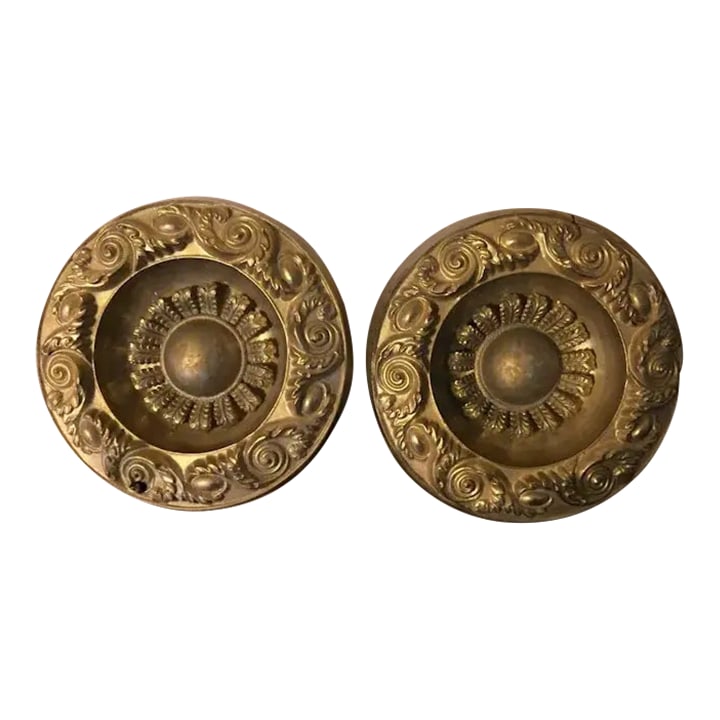 Antique 19th Century American Federal Empire Gilt Spun Brass Drapery Tie Backs - A Pair: Set of two very large antique 19th c. curtain tie backs - measuring 6 1/4" in diameter. Each with tasteful flower head design. Old darkened patina. Good condition - small split at the the side of