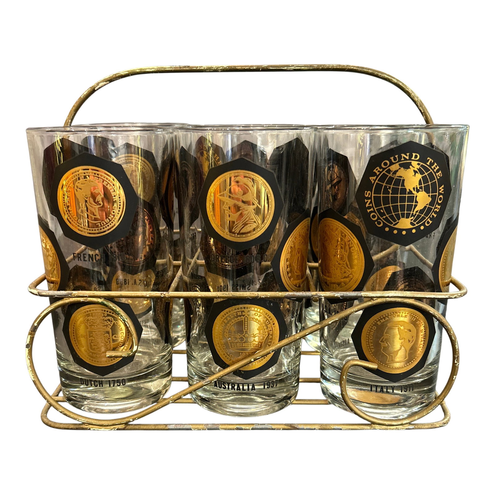 1950s Vintage Coins Around the World Highball Glasses in Original Brass Caddy 7 Pieces Total: Dimensions shown represent the overall caddy including glasses inside. The glasses alone measure 5.5 inches tall X 3 inches diameter Condition: Alterations: Original Condition Unaltered