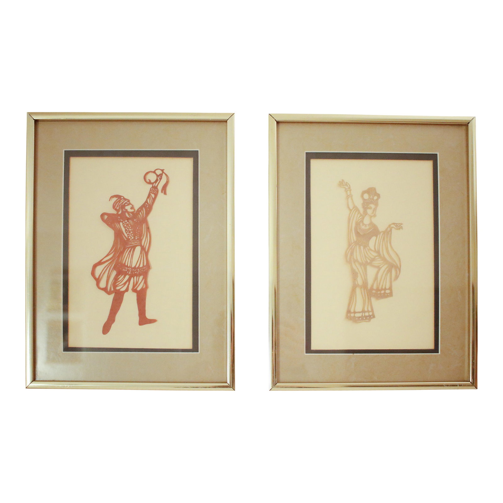 Early 20th Century Pair of Ottoman Shadow Puppet Figural Sculptures in MCM Gold Metal Frames: Presenting an exceptional pair of antique shadow puppets of Ottoman origins. These pieces capture dynamic figures in rich, sepia-toned silhouette: one a male figure in a traditional pose and the