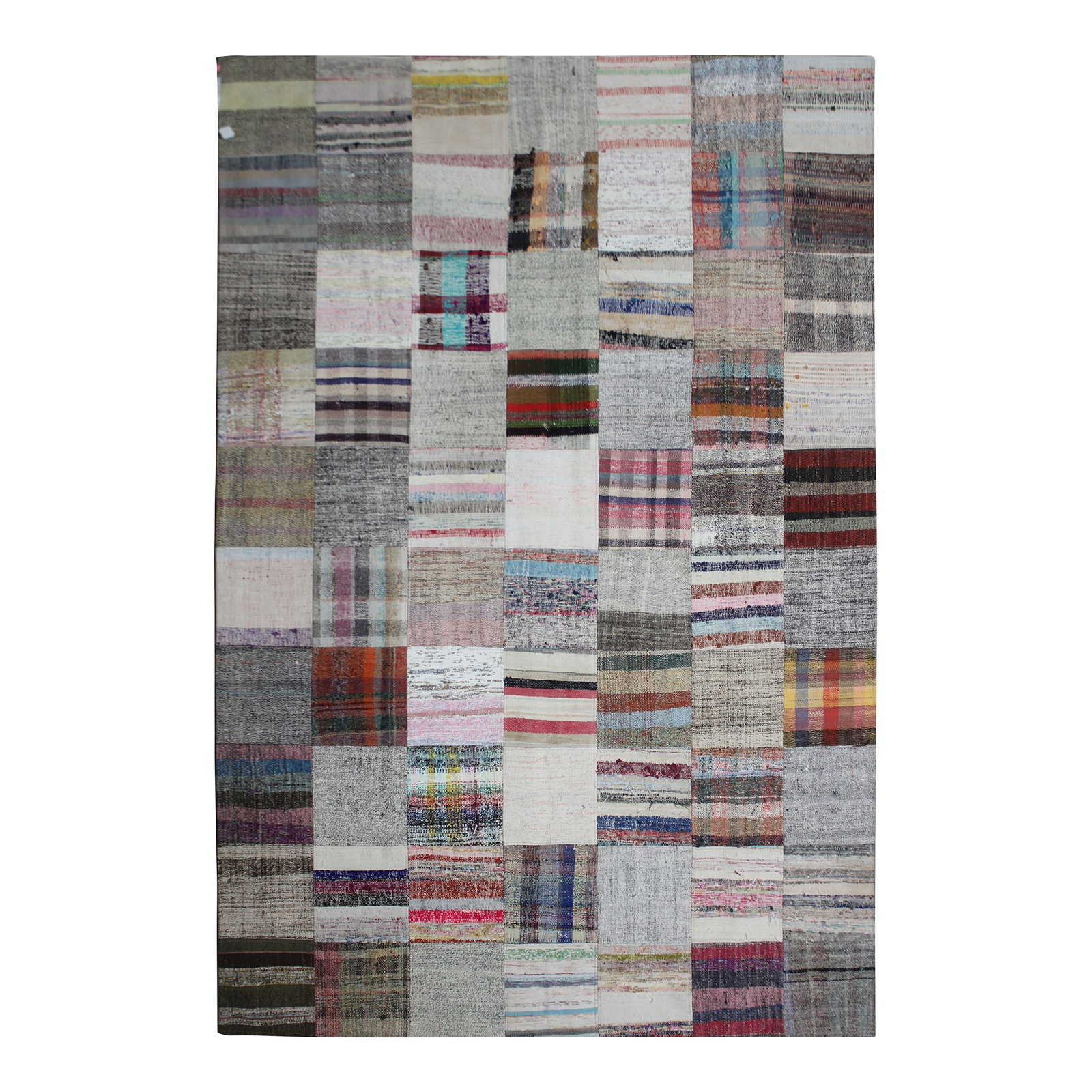 Handmade Vintage Patchwork Rug. 6'9" X 9'10": A beautiful antique Patchwork Kilim. It's in very good condition, practically new. This Patchworks kilim is produced of older handwoven kilims that are about 60 years old, and have been cut in smaller