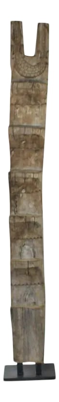 Mid 20th Century African Wooden Ladder On Custom Iron Base: This beautifully carved antique wood ladder comes from the Dogon tribal people of Mali. These ladders, carved out of a single piece of wood, were traditionally used to access the upper levels of
