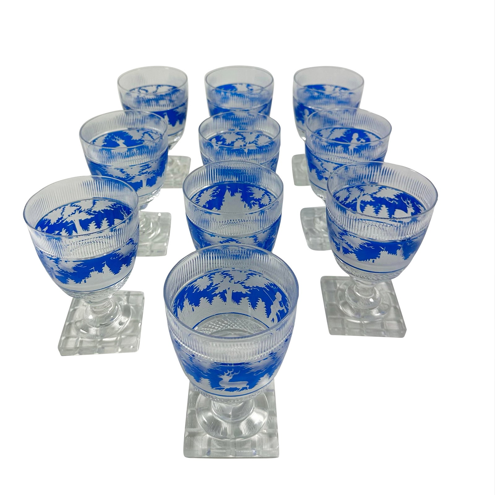 Mid 19th Century Bohemian Blue Overlay Cut Glass Goblets - Set of 10: Spectacular set of 10 bohemian blue overlay cut glass goblets from the mid-late 19th century. Very rare to have a large service intact. If the scenes were more complex, I would have guessed 1840s to