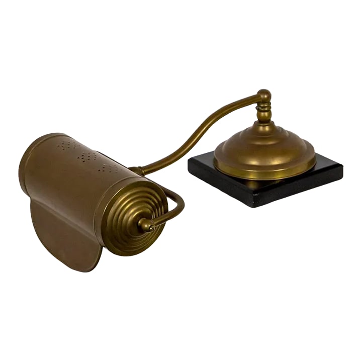 Antique Dale Co. Brass Piano Lamp With Slate Base: An early 20th century, well crafted and designed piano lamp with a pivoting shade pierced with three "snowflakes" on the top. It has an elegant, slight curved neck that swivels 360 degrees. It has a