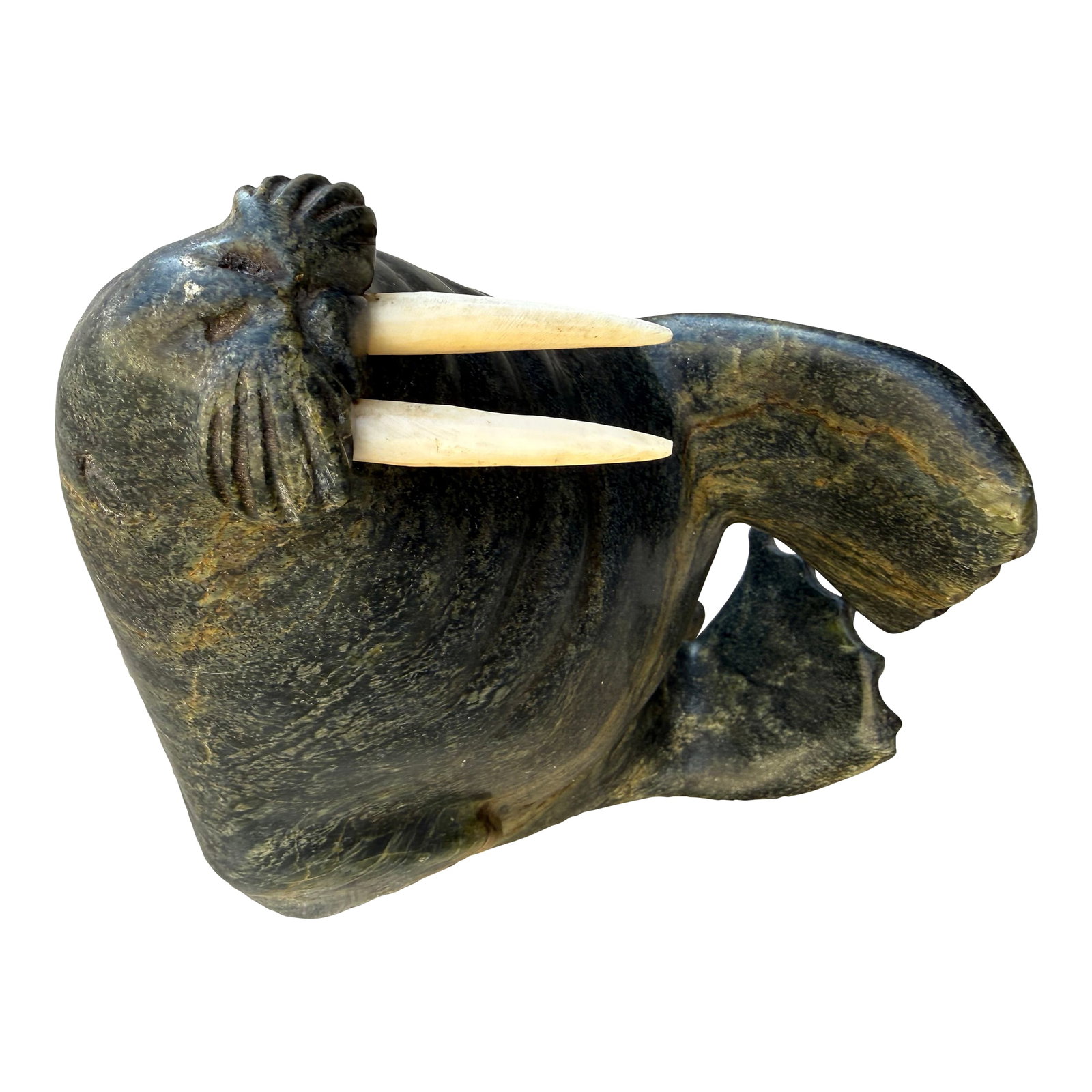 Eskimo Walrus Stone Sculpture by Adami Alariaq: Gorgeous sculpture by Adamie. A well known Intuit artist. Fluid design with tawny streaks in the black polished stone. Condition: Alterations: Original Condition Unaltered Imperfections: Some