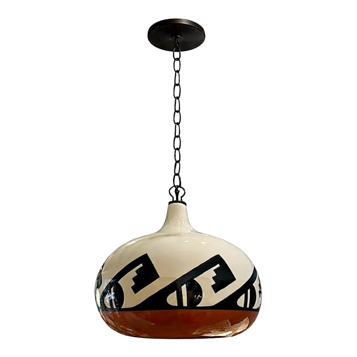 Vintage Ceramic Pendant Pendant With Southwest Design: Vintage ceramic pendant light featuring a bold Southwest-inspired geometric design. The rounded globe form showcases contrasting black motifs against a cream ground with a warm terracotta band at the