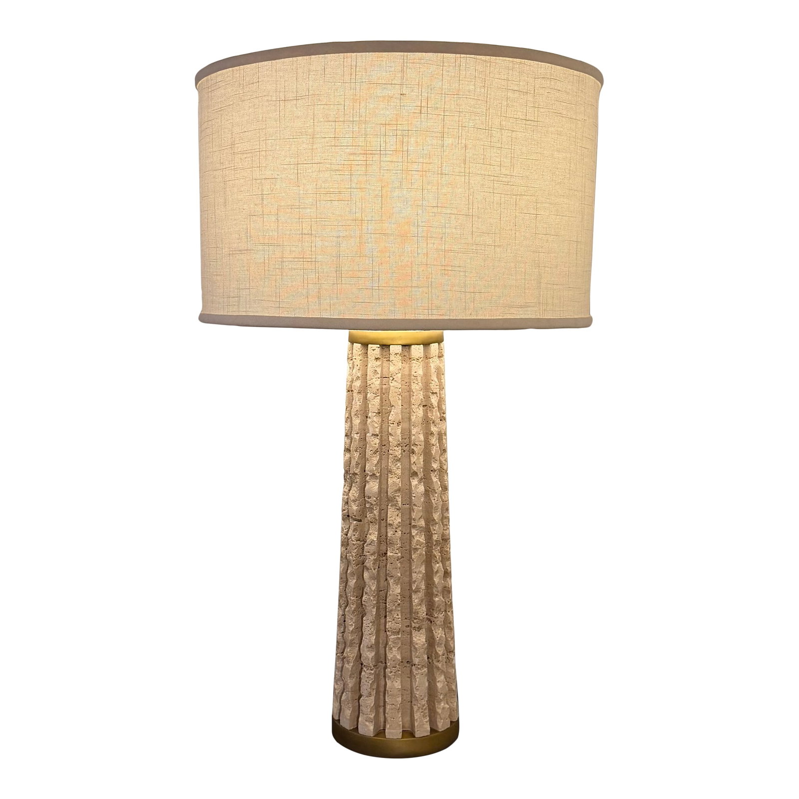 Travertine "Quarry" Lamp From Studio a by Global Views: Studio A by Global Views Quarry Table Lamp in natural travertine with warm brass accents. The sculptural fluted stone base highlights the organic movement and natural variation of the travertine,