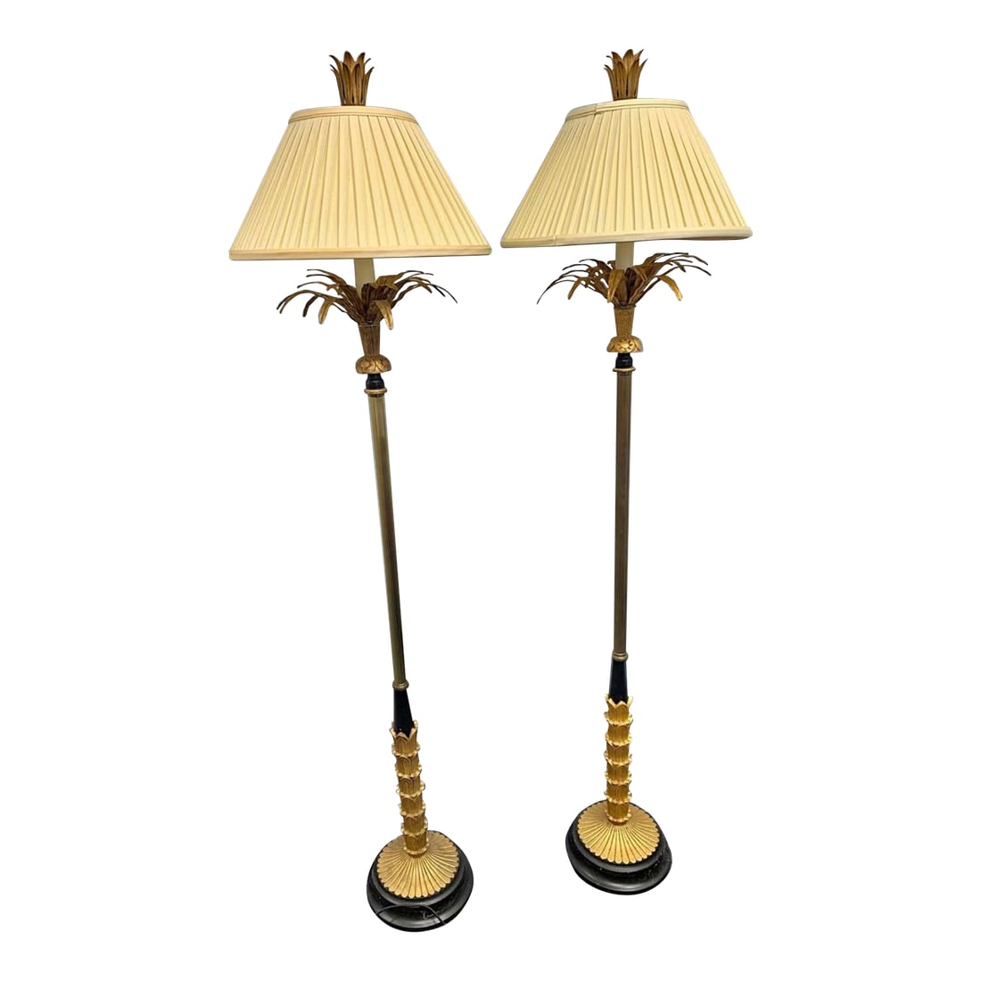Pair of Vintage Mid-Century Hollywood Regency Brass Palm Floor Lamps in Gold and Black: These gorgeous lamps are Hollywood Regency Mid Century. They are 5'3 tall. They are gold painted palm leaves with painted carved wooden palm decoration wrapping the brass lamp pole. The base has a