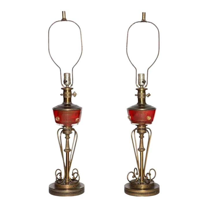 Tall Red Murano Glass and Brass Oil Lamp Style Table Lamps, 1940s - A Pair: Larger pair of Hollywood Regency red Murano glass and brass table lamps, circa 1950. Featuring an oil lamp style, bowl shaped translucent red Murano glass center with round gold inclusions, brass top 