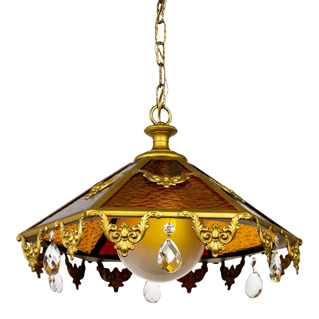 Mid 20th Century Paneled Amber Glass Pendant Light With Crystal Accents: An antique pendant light with 6 rippled, stained glass panes forming a coolie shape; alternating between amber and red-brown. With a large, white, globe shade and gold painted trim and garland