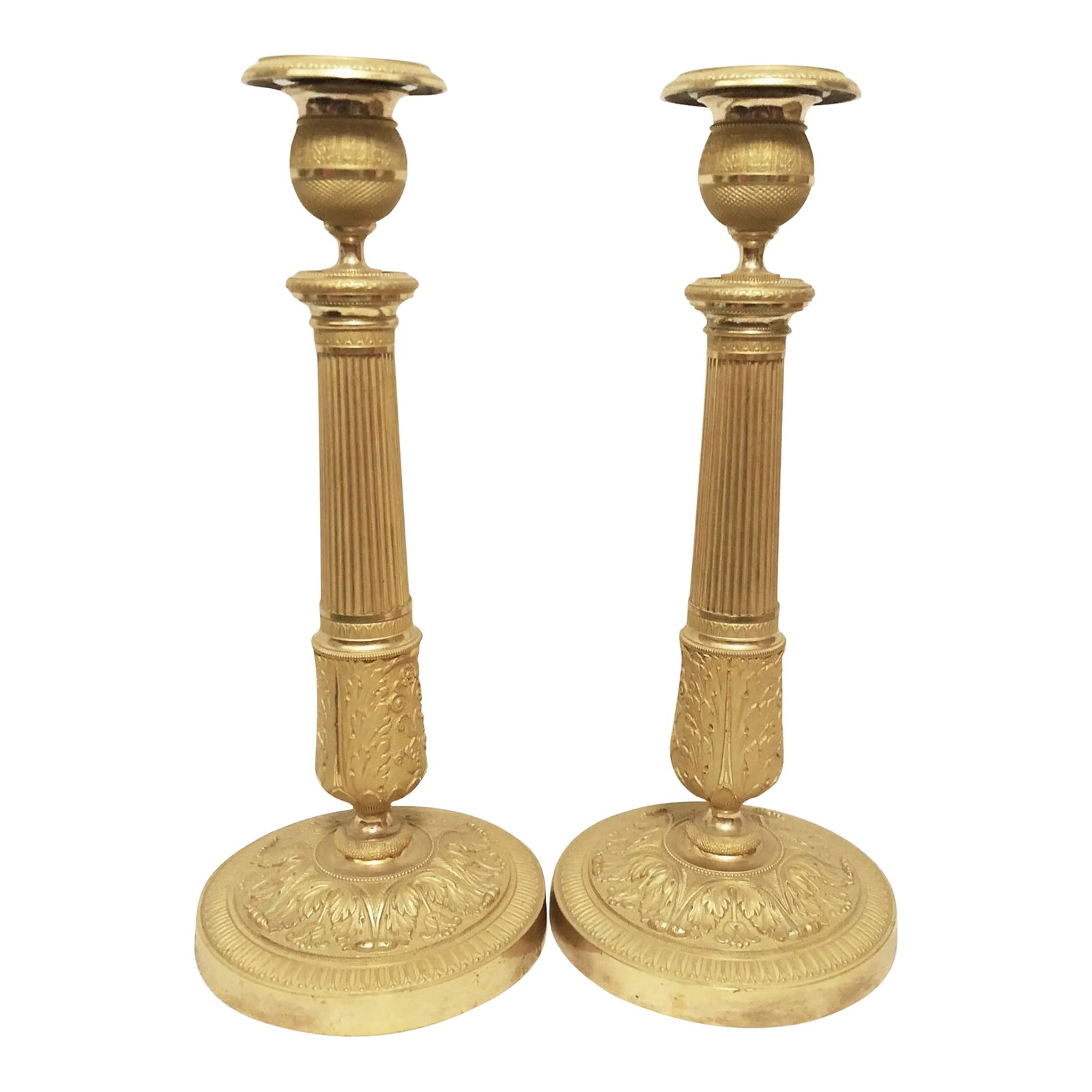 French Empire Gilt Bronze Ormulu Candlesticks - a Pair: Exceptional French Empire Gilt Bronze Candlesticks. Amazingly fine detail throughout. Original fire gilding. Measure 12 inches tall. Excellent condition. Unusual spherical top with very fine detail.