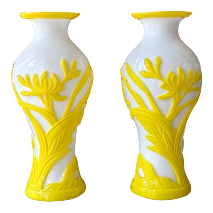 Pair of Late 19th-Century Victorian White & Yellow Overlay Art Glass Vases: Striking pair of late 19th-century art glass vases featuring substantial opaque white glass bodies with vivid yellow glass decoration. Raised flowers, leaves and sweeping stems are applied and tooled 