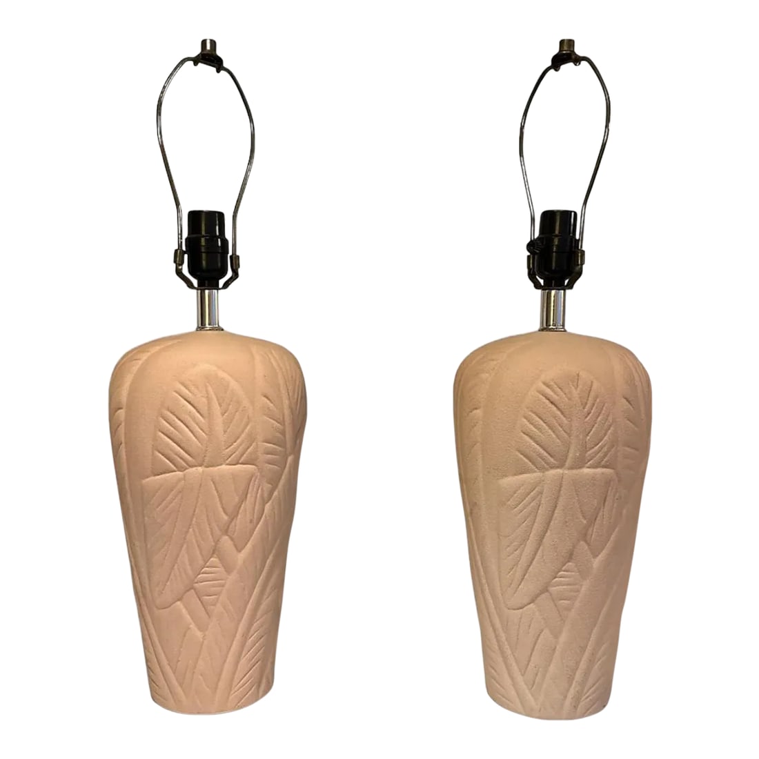 1980s Pink Ceramic Plaster Palm Leaf Lamps - a Pair: Pair of Ceramic Table Lamps Pink Plaster Textured Base w/ Embossed Palm Leaves Motif Lamp dimensions: 13" High x 4.5" Base tapers to 7" W Height to top of brass harps: 23" Condition: Alterations: Orig
