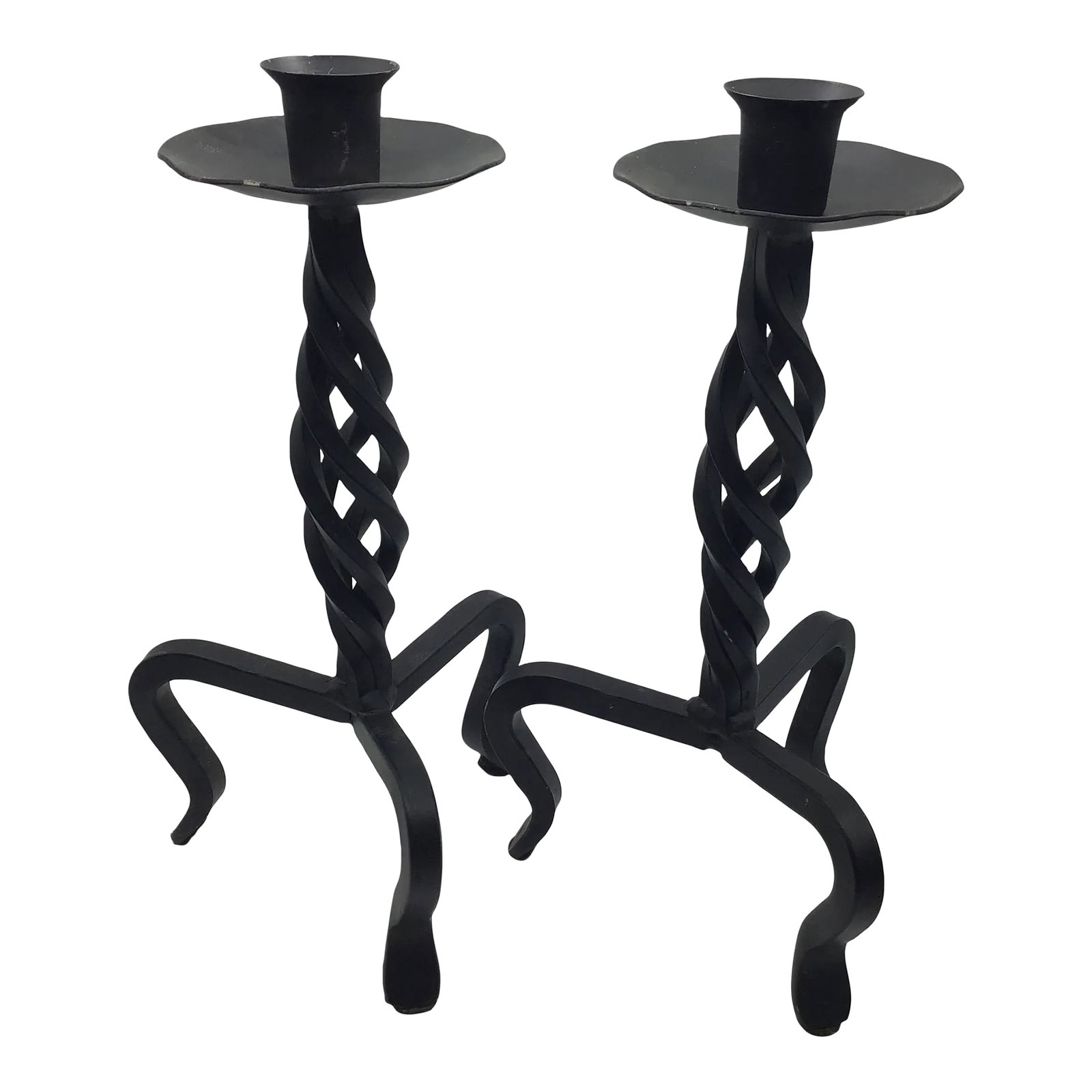 Vintage Brutalist Hand Wrought Twisted Iron Candle Holders Forged Hand Wrought Iron Brutalist Pair o: Vintage pair of forged black wrought iron candlestick holders. Features a bird nest twist on the shaft of the holder. Has three curved legs. They are not identical because they are hand forged Black p