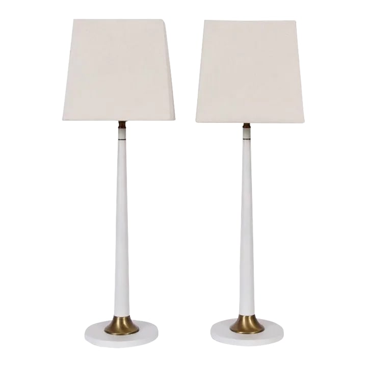 Tall Rembrandt Lamp Co. White Candlestick Lamps with Glass Shades, 1950s - A Pair: Pair of Rembrandt Lamp Company off white enamel and brass lamps with white milk glass shades. Featuring slim white candlesticks, and White glass liner shades on Round base. Patinated brass details. Sm