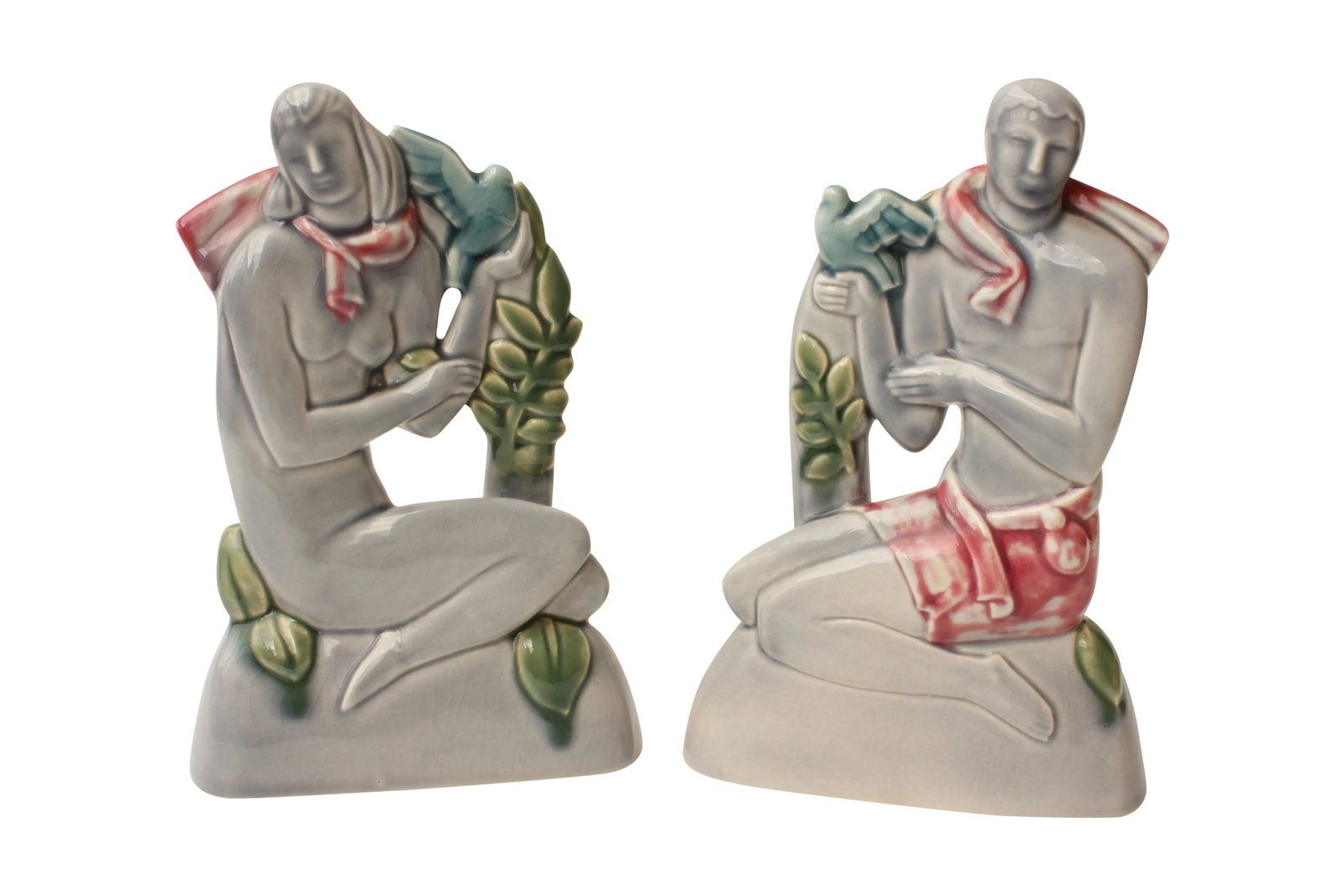 Art Deco Male and Female Sculpture - Pair: Pair of very fine Art Deco ceramic sculptures depicting highly-stylized male and female figures, each holding doves. The gray, deep pink and blue-green glazes are lovely. Could this be Adam and Eve?