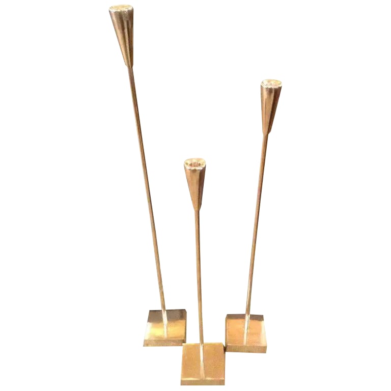 Late 20th Century Aluminum Tiered Floor Candlesticks - Set of 3: Modern and elegant, this trio of tall, slender candle sticks will be the perfect touch beside a master bathtub or gathered on a fireplace hearth. Fashioned from aluminum, of varying heights, the polis