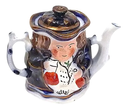 Antique British Gentleman Teapot: Antique; 1900-1910, porcelain, British, gentleman, miniature teapot with lid, spout, and handle. Lid is the top of the hat. Hand-painted depiction of a Bristish gentleman. Marked "Old Castle, Made In 
