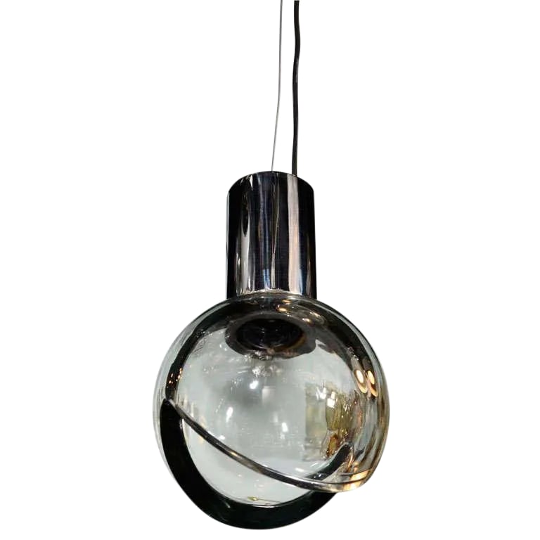 Seguso Grey Glass Globe Pendant Light: A 1960s handblown grey glass globe and chrome mount pendant light produced by the famed Seguso glass house in Murano, Italy. Features a pie shape cut-out on the bottom and suspended from a chromed