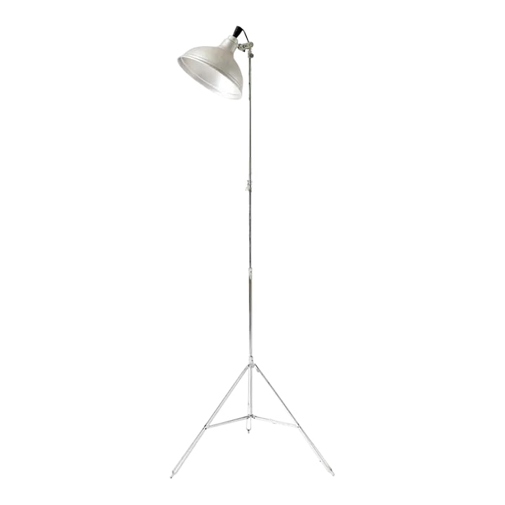 Mid-Century Photographer's Light, C. 1950: - Taken from the floor of a mid-century photography studio, this vintage floor lamp is a sculptural, fully functional piece of industrial design. - With an adjustable height, base, and shade angle, th