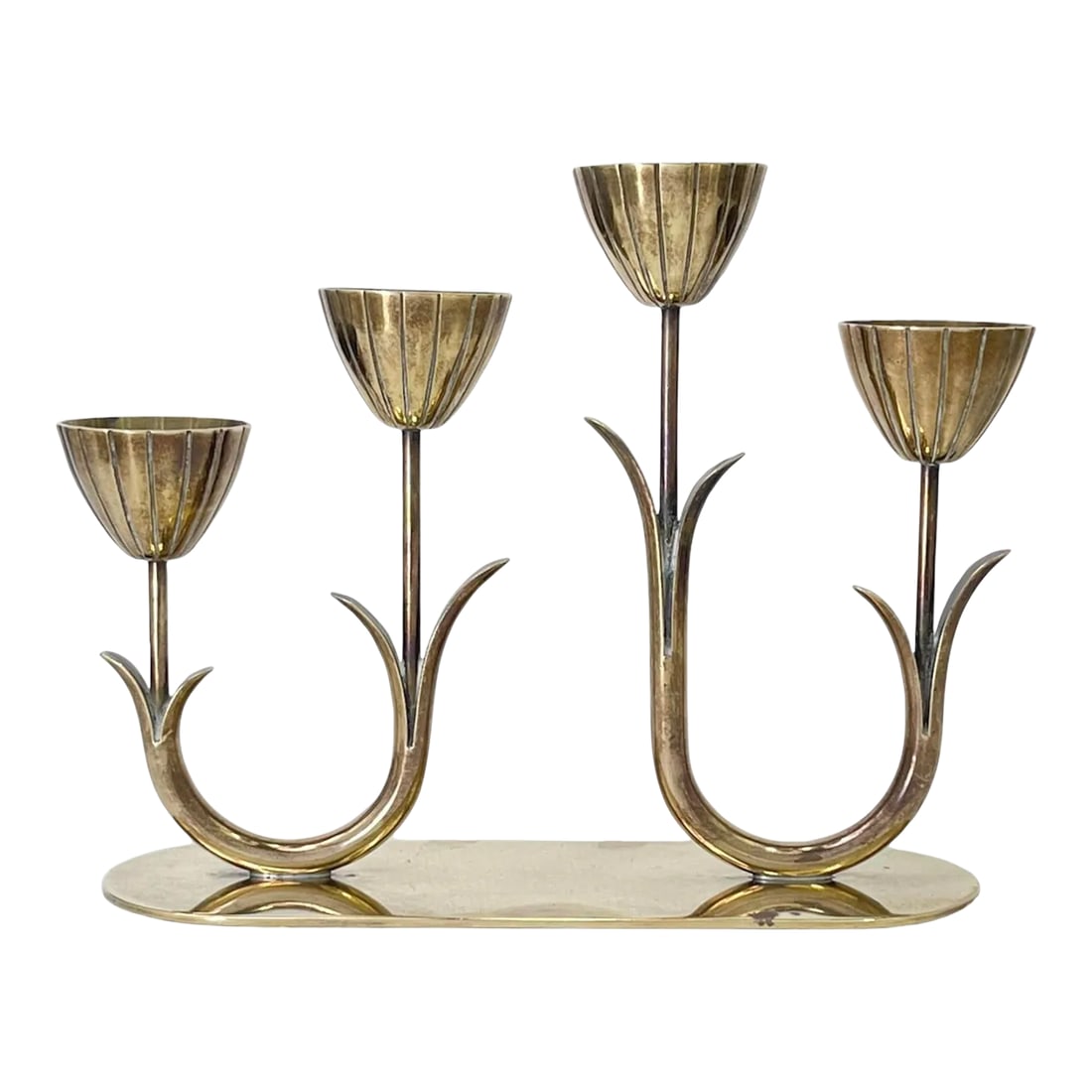 1950s Swedish Brass Candelabra by Gunnar Ander: Add a classic Swedish touch to your decor with this iconic mid-century brass candelabra designed by Gunnar Ander for Ystad Metall in the 1950s. This graceful, candlestick with four tulip-shaped