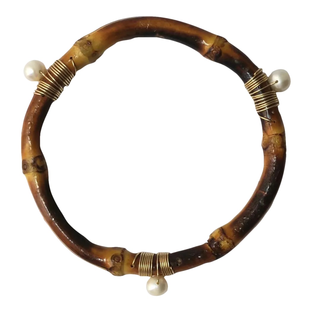 Pearl and Bamboo Bangle Bracelet: This is part of Chairish's Fine Jewelry assortment. A freshwater pearl and bamboo bangle bracelet. Beautiful as a standalone bangle bracelet - simple and elegant, or wear stacked with other bracelets