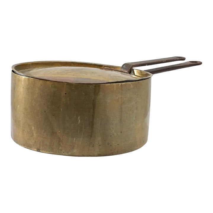 Antique French Brass Pot with Lid: Made in 19th Century France, this wide pan is handmade from brass and iron. The sizeable surface has certainly seen its share of kitchen work through the years, the time touched patina revels in the