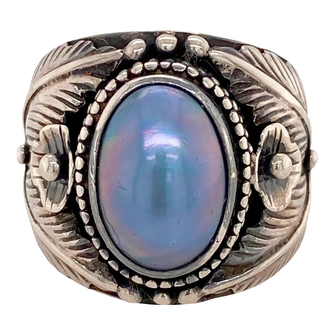 Modern Sterling Silver and Blue Pearl Ring Size 7: This is part of Chairish's Fine Jewelry assortment. A fun sterling silver ring with applied flowers and a bezel set blue pearl. The ring is finely made and is artist signed, Merav, 925 and Indonesia. 