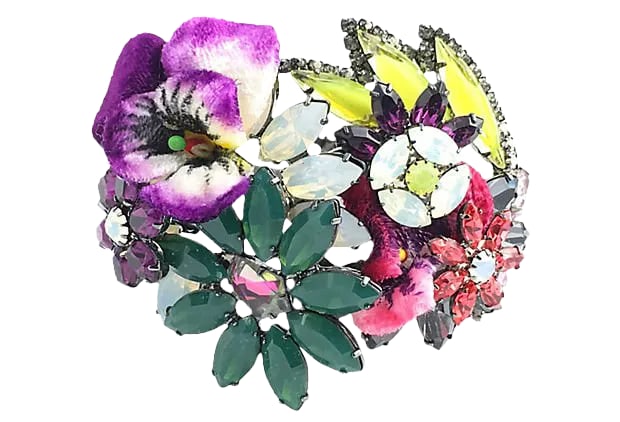 Floral Bangle Bracelet by Elizabeth Cole: Elizabeth Cole bangle featuring floral velvet embellishments and Swarovski crystal flowers and leaves. Gunmetal finish. The cuff bracelet closes in front and has a hinge in the back. Due to the