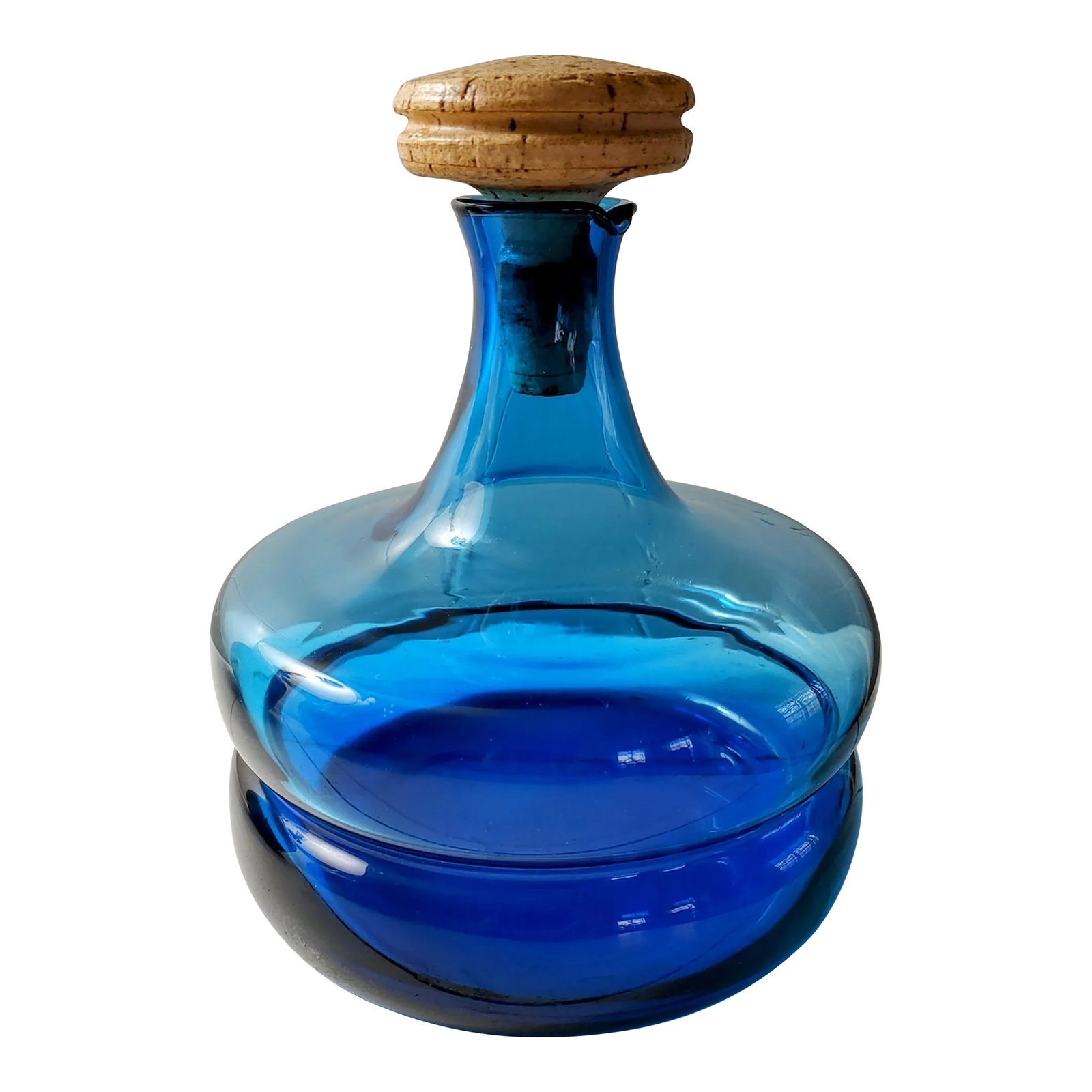 Mid 20th Century Italian Peedee Blue Blown Glass Decanter: Here's a beautiful blown glass decanter with the original cork stopper in a rich shade of blue. Attributed to Peedee Italy. The sticker was removed at some point. A stellar piece of MCM glass and a