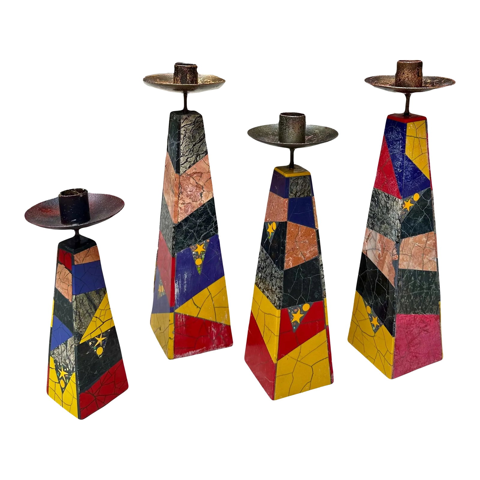 1980's Peter Max Inlaid Marble Candlesticks -Set of 4: For obelisk shaped candlesticks by Peter Max. Each features and mosaic marble design in laid with stars and confetti of different colors. There are damages to some of the candlesticks as shown in